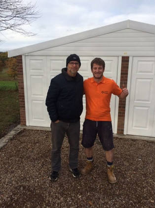 Outside new garage with Jason Connery